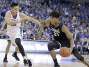 Gonzaga's Rui Hachimura (21) drives around Creighton's Martin Krampelj (15) during the first half of an NCAA college basketball game in Omaha, Neb., Saturday, Dec. 1, 2018.