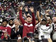 Oklahoma head coach Lincoln Riley hoists the Big 12 Conference championship trophy after beating Texas 39-27 in the Big 12 Conference championship NCAA college football game on Saturday, Dec. 1, 2018, in Arlington, Texas.