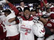 Washington State players celebrate a 28-26 win over Iowa State in the Alamo Bowl NCAA college football game, Friday, Dec. 28, 2018, in San Antonio.