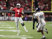 Ohio State quarterback Dwayne Haskins (7) throws as Northwestern defensive back Alonzo Mayo (10) defends during the second half of the Big Ten championship NCAA college football game, Saturday, Dec. 1, 2018, in Indianapolis.