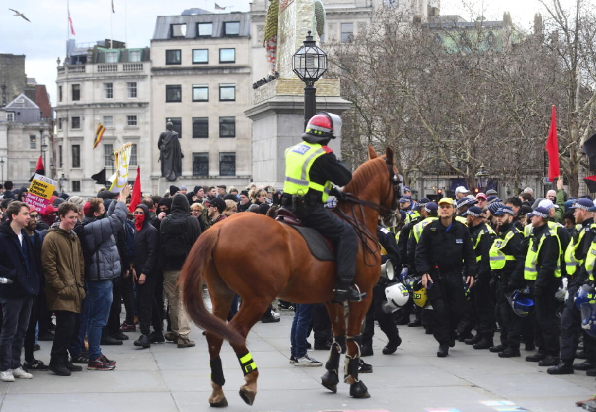 Police attempt to keep rival Brexit protest groups from clashing in central London, Sunday Dec. 9, 2018. The “Brexit Betrayal Rally” led by English far-right activist Tommy Robinson and UK Independence Party, UKIP, leader Gerard Batten, protesting for a split from Europe, and a Pro-Europe anti-fascist counter-demonstration both marched in central London.