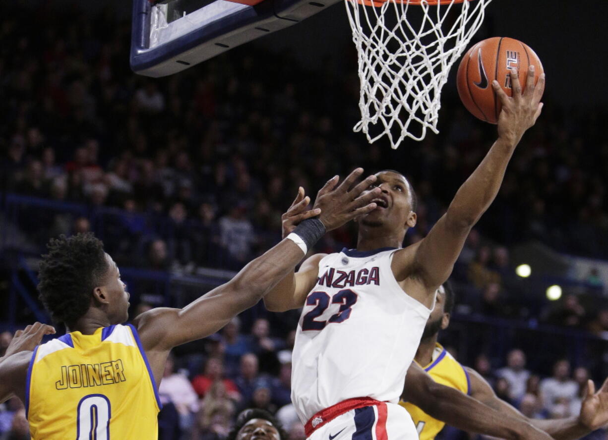 Gonzaga guard Zach Norvell Jr. (23) shoots while defended by Cal State Bakersfield guard Jarkel Joiner (0) during the second half of an NCAA college basketball game in Spokane, Wash., Monday, Dec. 31, 2018.