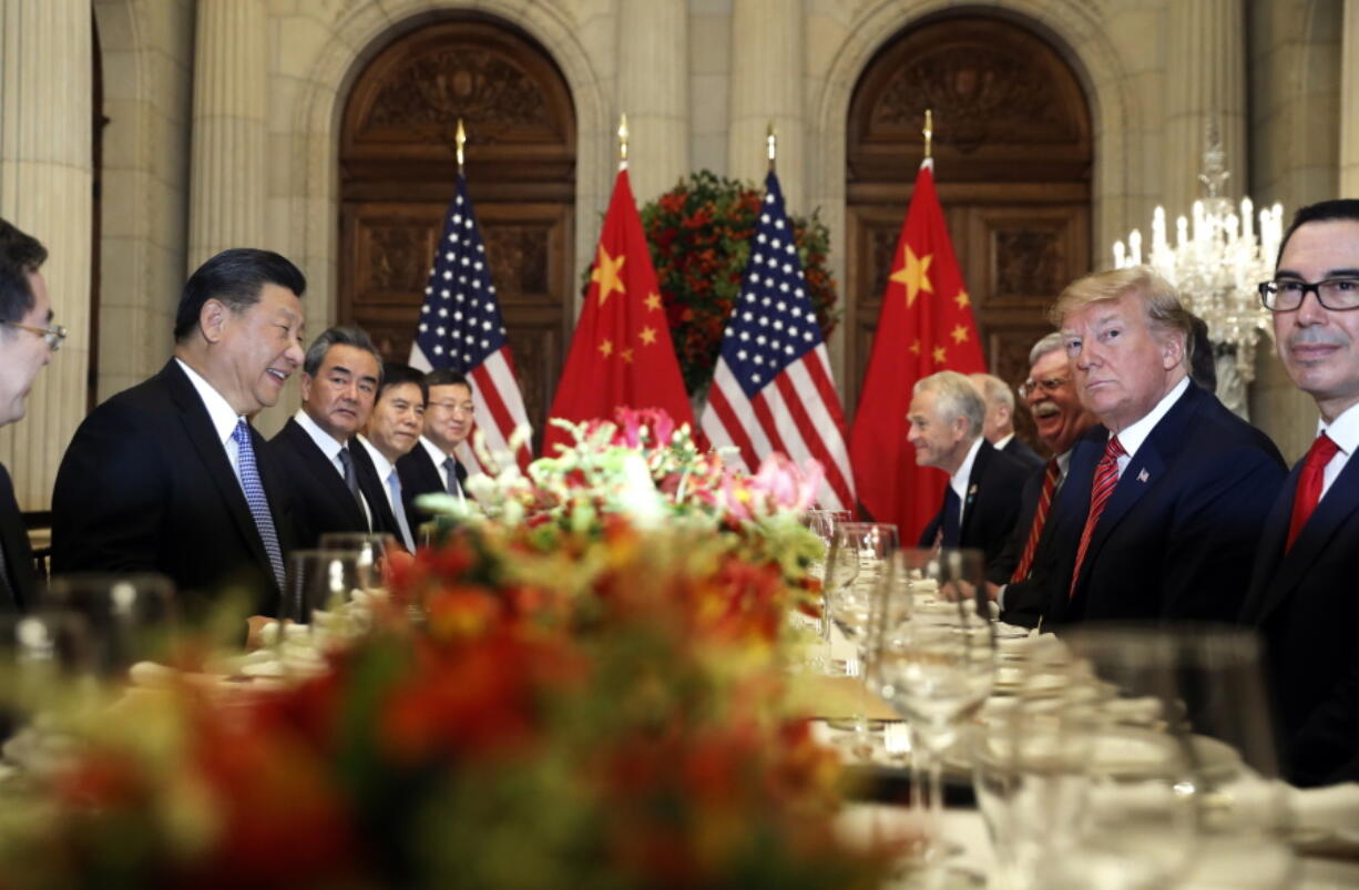 FILE - In this Dec. 1, 2018, file photo, U.S. President Donald Trump, second right, and China’s President Xi Jinping, second left, attend their bilateral meeting at the G20 Summit in Buenos Aires, Argentina. A U.S.-Chinese cease fire on tariffs gives jittery companies a respite but does little to resolve a war over Beijing’s technology ambitions that threatens to chill global economic growth.