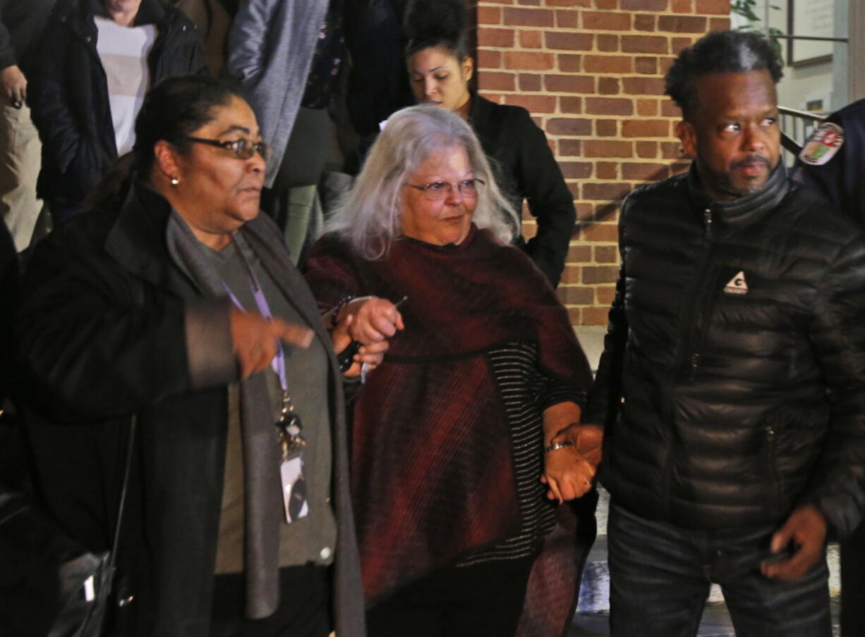 Susan Bro, center, mother of Heather Heyer, is escorted down the steps of the courthouse after a guilty verdict was reached in the trial of James Alex Fields Jr., on Friday at Charlottesville General district court in Charlottesville, Va. Fields was convicted of first degree murder in the death of Heather Heyer as well as nine other counts during a “Unite the Right” rally in Charlottesville .