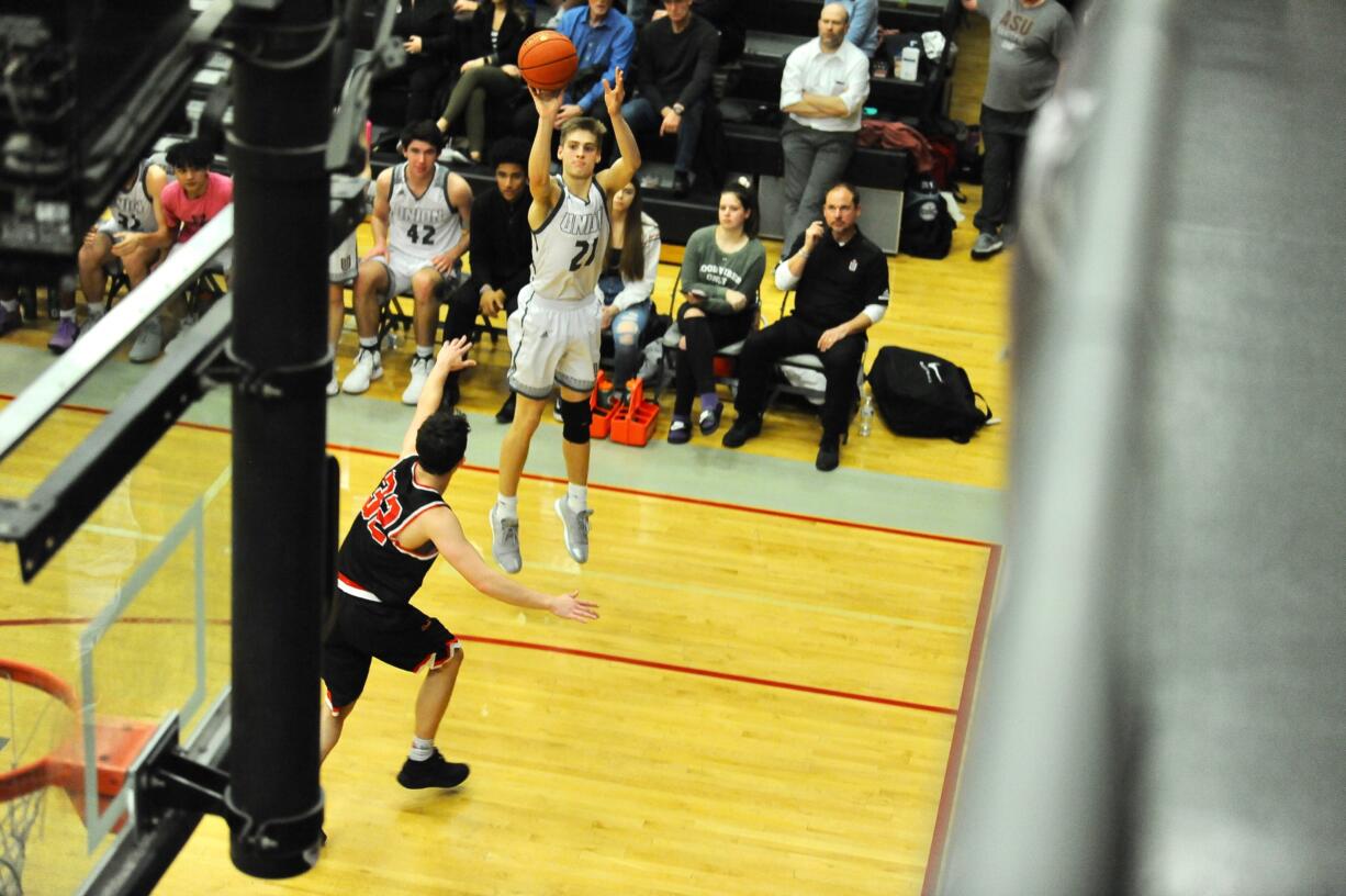 Union forward Tanner Toolson releases a corner 3, contributing to his 22 points during a 79-63 win over the Papermakers on Monday night at Union High School.