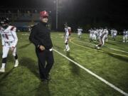 Neil Lomax, Fort Vancouver head coach, runs warm ups before a game in the Kiggins Bowl on Friday night, Oct.