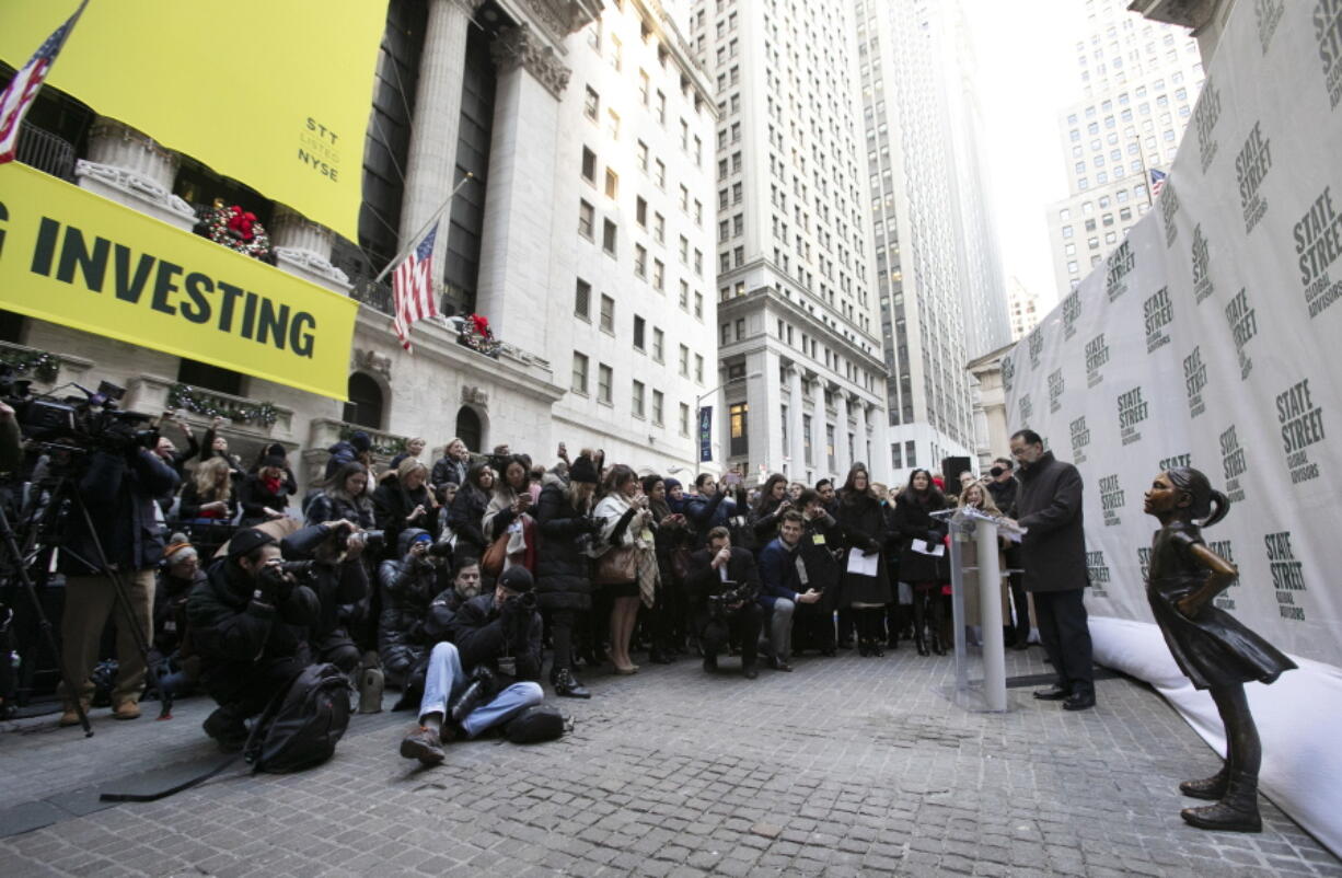 The Fearless Girl statue is unveiled at its new location in front of the New York Stock Exchange on Monday in New York. The statue, considered by many to symbolize female empowerment, was previously located near the Charging Bull statue on lower Broadway.