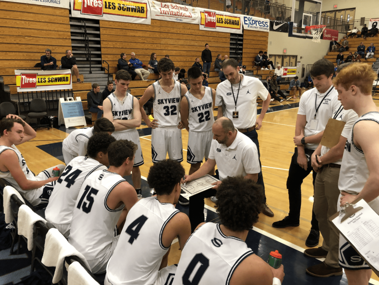 The Skyview basketball team huddles around coach Matt Gruhler during a 68-67 loss to West Linn (Ore.) in the first round of the Les Schwab Invitational.