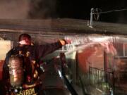 The Camas-Washougal Fire Department working on a fire in an attached garage at a home on the 4000 block of C Street, Washougal. The occupants were home, but evacuated without injuries.