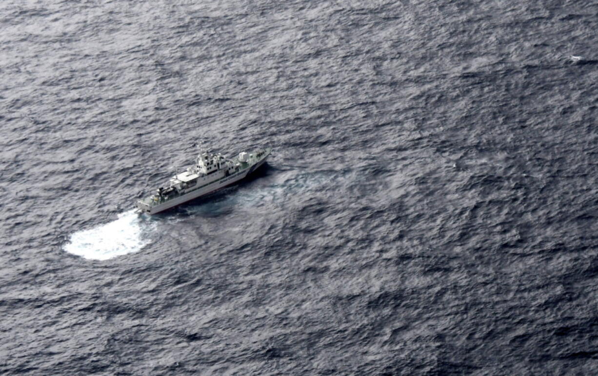 In this aerial photo, Japan’s Coast Guard ship is seen at sea during a search operation for U.S. Marine refueling plane and fighter jet off Muroto, Kochi prefecture, southwestern Japan, Thursday, Dec. 6, 2018. A Marine refueling plane and a fighter jet crashed into the Pacific Ocean off Japan’s southwestern coast after a midair collision early Thursday, and rescuers found one of the seven crew members in stable condition while searching for the others, officials said. The U.S. Marine Corps said that the 2 a.m. crash involved an F/A-18 fighter jet and a KC-130 refueling aircraft during regular training after the planes took off from their base in Iwakuni, near Hiroshima in western Japan.