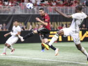 Atlanta United midfielder Miguel Almiron (10) has a shot defended by Portland Timbers defender Larrys Mabiala (33) in the second half of an MLS match on June 24, 2018 at Atlanta. Before an expected crowd of more than 70,000, Atlanta United will host the Portland Timbers in the MLS Cup championship game Saturday, Dec. 8, 2018.