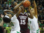 Oregon forward Ruthy Hebard is fouled by Mississippi State center Teaira McCowan as Oregon forward Satou Sabally helps out on the play in the second quarter of a women’s college basketball game Tuesday, Dec. 18, 2018, in Eugene, Ore. No. 7 Oregon defeated No. 4 Mississippi State 82-74.