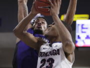 Gonzaga guard Zach Norvell Jr. (23) shoots while defended by North Alabama forward Emanuel Littles during the second half of an NCAA college basketball game in Spokane, Wash., Friday, Dec. 28, 2018. Gonzaga won 96-51.