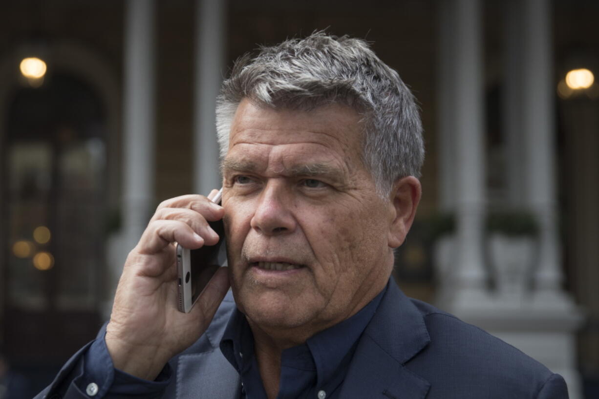 Self-styled Dutch positivity guru Emile Ratelband answers questions on his mobile phone during an interview in Amsterdam, Netherlands, Monday, Dec. 3, 2018. A Dutch court has rejected the request of a self-styled positivity guru to shave 20 years off his age, in a case that drew worldwide attention. Emile Ratelband last month asked the court in Arnhem to formally change his date of birth to make him 49, instead of his real age of 69. He argued his request was consistent with other personal transformations, such as the ability to change one’s name or gender. The Dutch court said age matters under Dutch law.