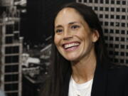 Sue Bird jokes with reporters as she talks about her new role as basketball operations assistant for the Denver Nuggets before an NBA basketball game Sunday, Dec. 16, 2018, in Denver.