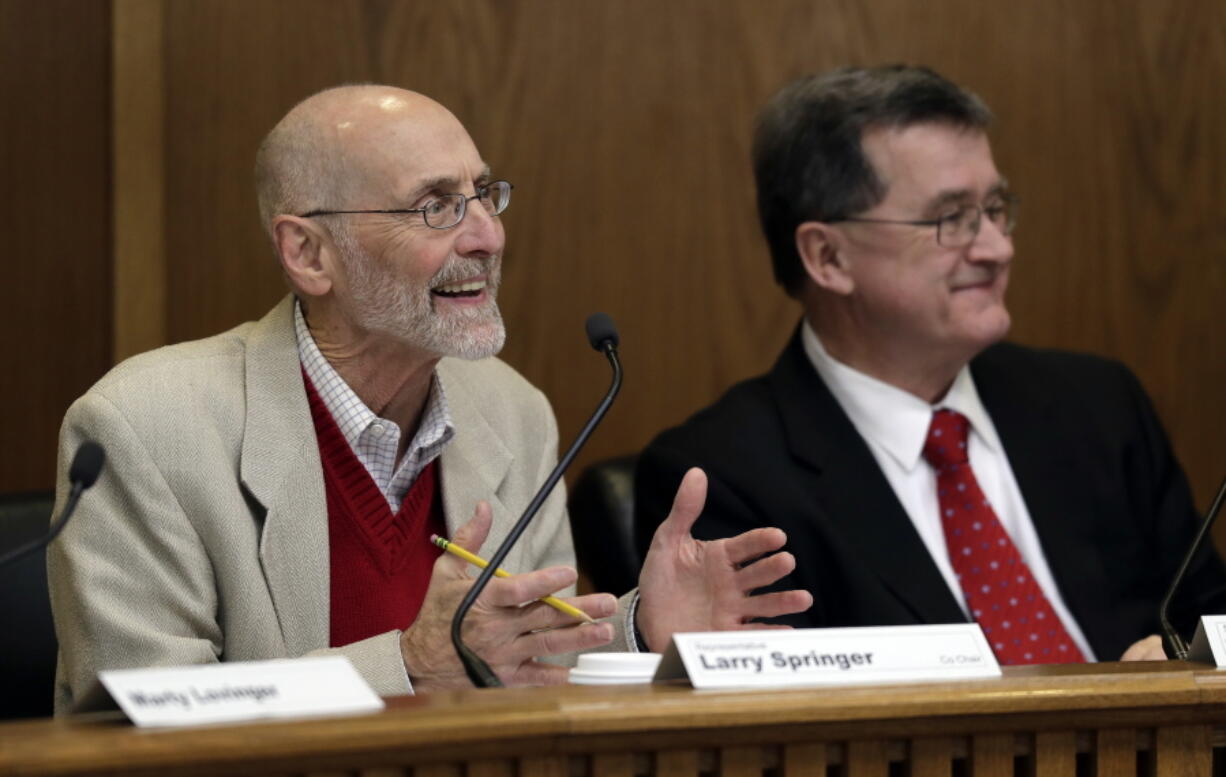 Rep. Larry Springer, D-Kirkland, left, co-chair of the Legislative Task Force on Public Records, speaks Friday, Dec. 7, 2018, as he sits next to co-chair Sen. Curtis King, R-Yakima, right, during a task force work session at the Capitol in Olympia, Wash. The panel was formed after a lawsuit produced a ruling that state legislators are subject to Washington state’s public records law. (AP Photo/Ted S.