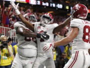 Alabama wide receiver Jerry Jeudy (4) celebrates his touchdown against Georgia during the second half of the Southeastern Conference championship NCAA college football game, Saturday, Dec. 1, 2018, in Atlanta.