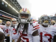 San Francisco 49ers cornerback Richard Sherman, center, huddles with teammates before playing against the Seattle Seahawks, in Seattle. The rematch between the Seahawks and 49ers is on Sunday, Dec. 16.