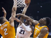 Gonzaga’s Rui Hachimura (21) is fouled by Tennessee’s Admiral Schofield (5) and Grant Williams (2) during the first half of an NCAA college basketball game Sunday, Dec. 9, 2018, in Phoenix.