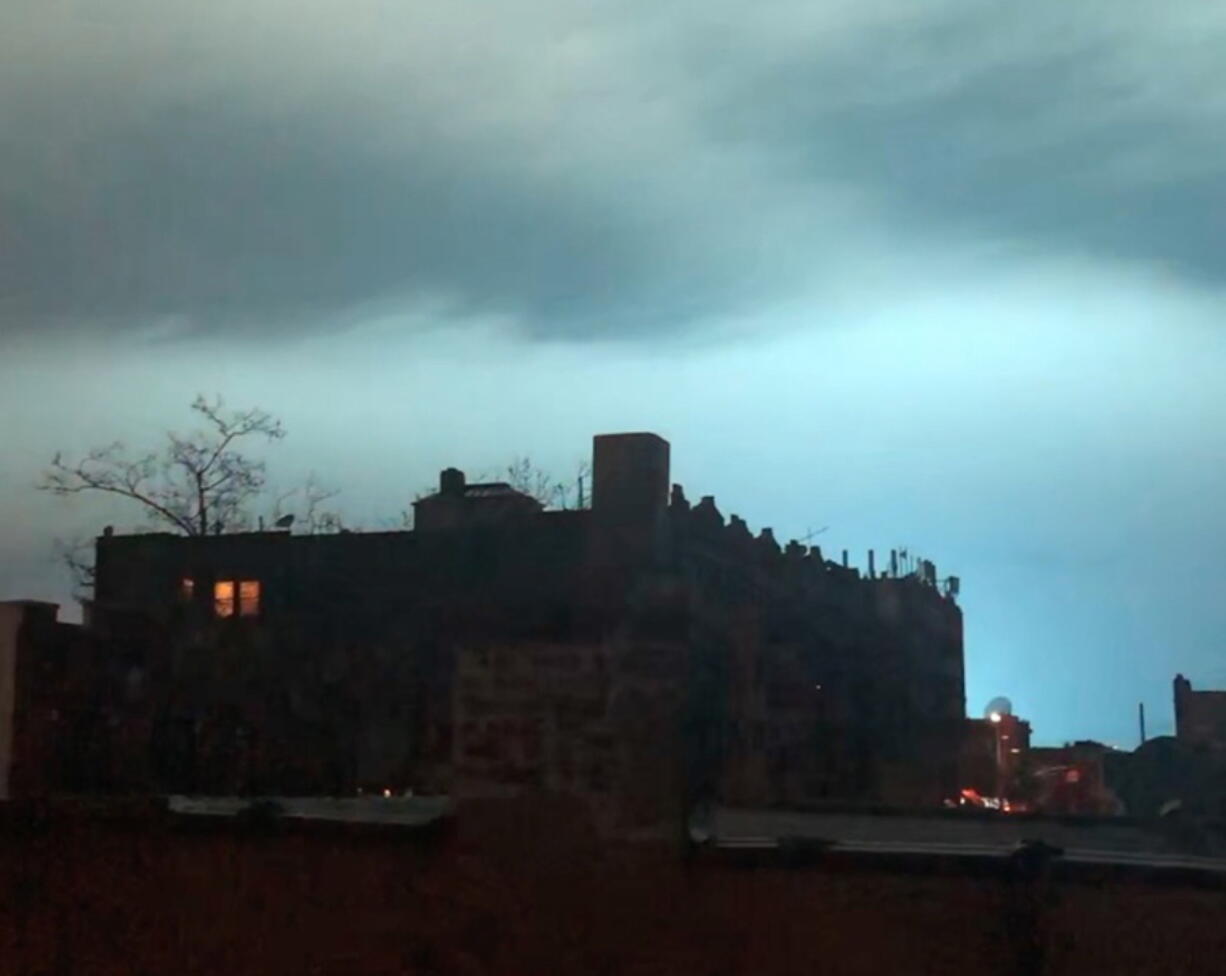 In this image taken from video, the night sky is illuminated in a bright, blue color after an explosion in the Queens borough of New York, Thursday, Dec. 27, 2018. New York police say a transformer exploded at a Con Edison facility in Queens. The explosion caused a bright, blue light that illuminated the New York skyline and caused a stir on social media.