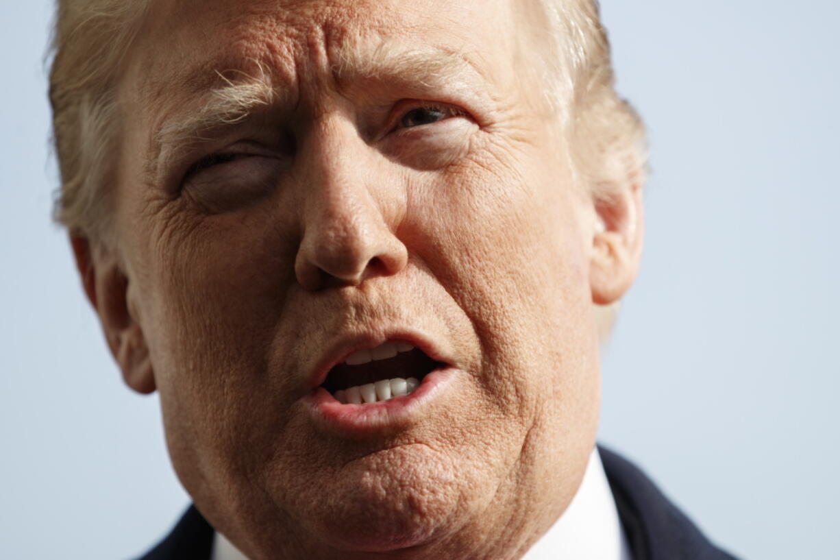 President Donald Trump talks to media before boarding Marine One on the South Lawn of the White House in Washington, Saturday, Dec. 8, 2018, for the short trip to Andrews Air Force Base en route to Philadelphia to attend the Army-Navy Football Game.