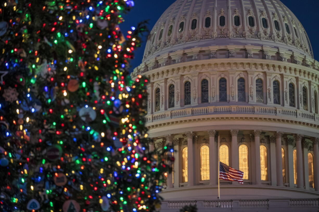 The Capitol is seen at twilight in Washington. The fight over President Donald Trump’s $5 billion wall funds deepened Monday, threatening a partial government shutdown in a standoff that has become increasingly common in Washington. (AP Photo/J.