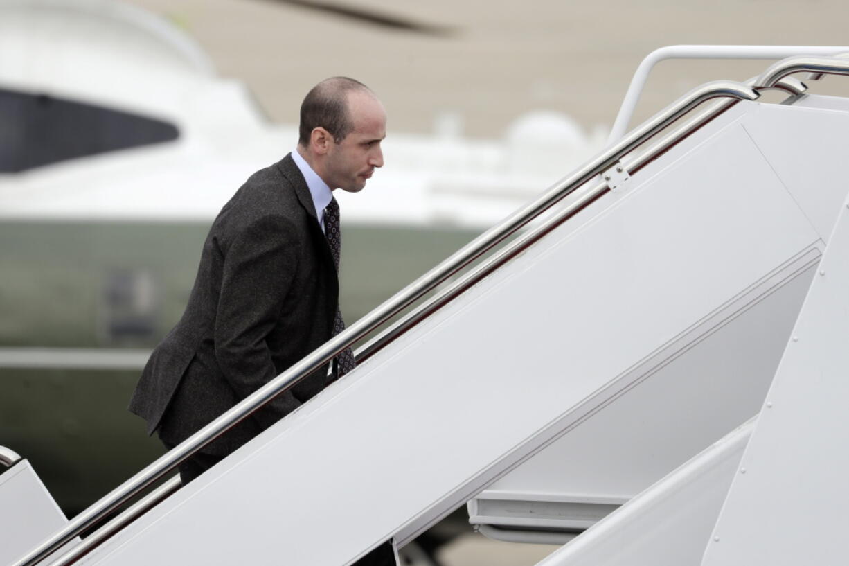 FILE - In this Nov. 2, 2018, file photo, President Donald Trump's White House Senior Adviser Stephen Miller boards Air Force One for campaign rallies in West Virginia and Indiana, in Andrews Air Force Base, Md. The White House is digging in on its demand for $5 billion to build a border wall as congressional Democrats stand firm against it, pushing the federal government closer to the brink of a partial shutdown. Miller says Trump is prepared to do “whatever is necessary” to build a wall along the U.S.-Mexico border.