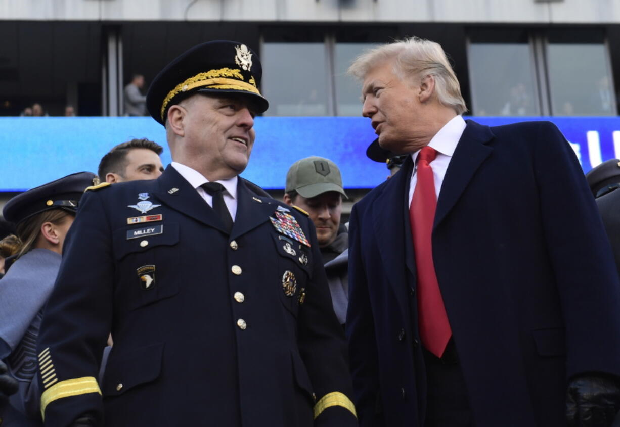 President Donald Trump, right, talks with Army Chief of Staff Gen. Mark Milley, left, during the Army-Navy NCAA college football game in Philadelphia, Saturday, Dec. 8, 2018. Trump announced that Milley will be the next chairman of the Joint Chiefs of Staff.