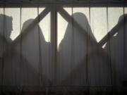 In this Sunday, April 1, 2018 file photo, nuns are silhouetted in St. Peter’s Square at the Vatican. The Vatican is facing a dilemma after nearly all the nuns in a tiny French religious order threatened to renounce their vows rather than accept the removal of their superior. The standoff marks an extraordinary battle of wills between the Vatican and the group of 39 nuns who run homes for the aged in rural France.