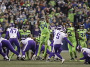 Seattle Seahawks’ Bobby Wagner (54) leaps to block a field goal attempt by Minnesota Vikings’ Dan Bailey in the second half of an NFL football game, Monday, Dec. 10, 2018, in Seattle.