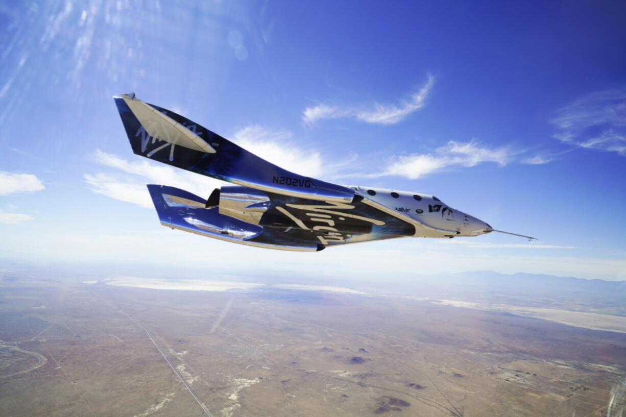 This May 29, 2018 photo provided by Virgin Galactic shows the VSS Unity craft during a supersonic flight test. The spaceship isn’t launched from the ground but is carried beneath a special aircraft to an altitude around 50,000 feet (15,240 meters). There, it’s released before igniting its rocket engine and climbing.