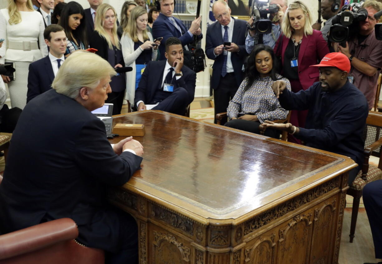 In this Oct. 11, 2018 file photo, rapper Kanye West speaks to President Donald Trump and others in the Oval Office of the White House in Washington.