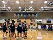 Skyview huddles before taking the court against Barlow (Ore.), a game it won 60-55 on the third day of the Les Schwab Invitational.