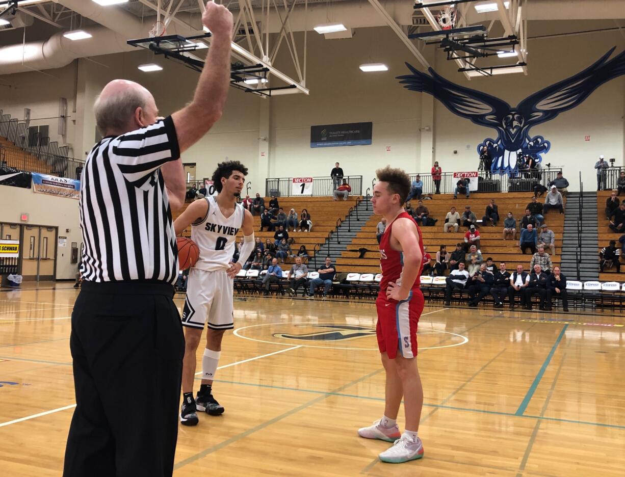 Skyview guard Alex Schumacher stares down a South Salem defender in the second half of a 67-60 win in the Les Schwab Invitational at Liberty High School in Hillsboro, Ore.