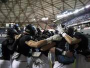 The Hawk circle up to pump each other up before the 2A state football championship game against Lynden on Saturday, Dec. 1, 2018, in Tacoma, Wash.