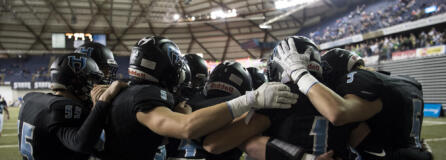 The Hawk circle up to pump each other up before the 2A state football championship game against Lynden on Saturday, Dec. 1, 2018, in Tacoma, Wash.