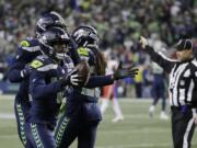 Seattle Seahawks defensive back Delano Hill (42) reacts after he recovered a fumble during the first half of an NFL football game against the Kansas City Chiefs, Sunday, Dec. 23, 2018, in Seattle.