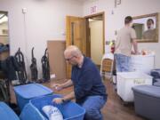 Darren Green collects his insulin from a storage container at St. Paul Lutheran Church, which provides overnight shelter for homeless men during the winter.