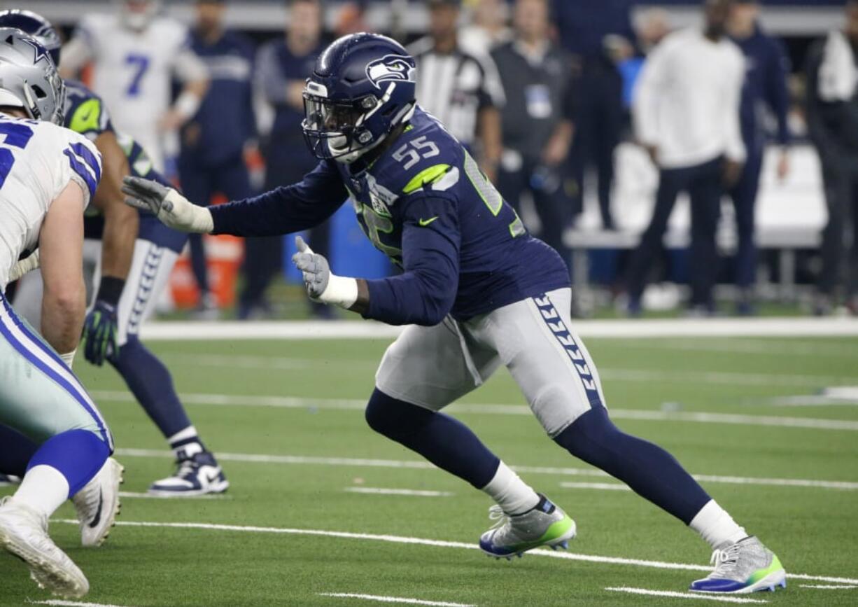 Seattle Seahawks defensive end Frank Clark (55) defends against a rush by the Dallas Cowboys during an NFC wild-card NFL football game in Arlington, Texas, Saturday, Jan.