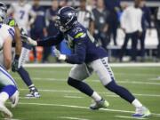 Seattle Seahawks defensive end Frank Clark (55) defends against a rush by the Dallas Cowboys during an NFC wild-card NFL football game in Arlington, Texas, Saturday, Jan.