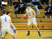 La Center forward Evan Norris gathers the ball during a 103-71 Wildcats win over Stevenson on Thursday night at La Center High School.