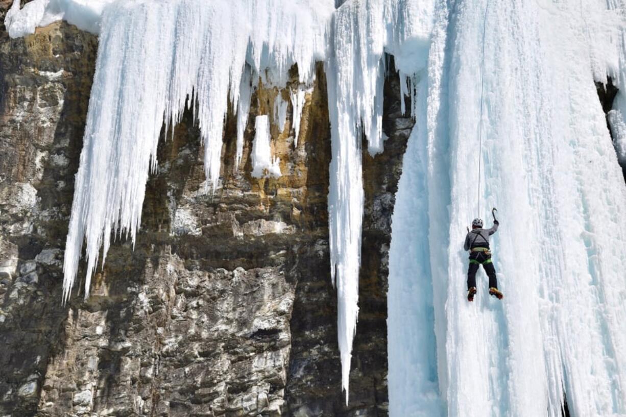 Maintaining a triangular body formation is key for novice ice climbers.