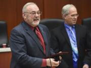 Tom Mielke, from left, accepts a plaque acknowledging his work on the Clark County Council in December 2016 with then-Chair Marc Boldt nearby. Mielke's name is on a list of candidates, released by the local GOP, seeking to complete the term of Republican county Councilor Eileen Quiring, the new council chair.