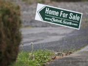 For-sale signs are posted in the Starcrest neighborhood in Vancouver in December.