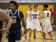 Prairie's Thomas Hapgood (10), Bronson King (24) and Aidan Fraly (2) celebrate their win after the game against Kelso in Vancouver on Jan. 22, 2019.