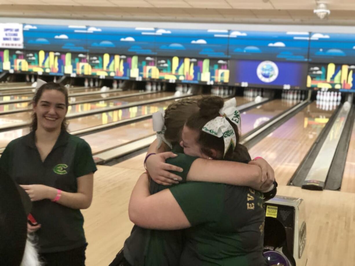 Evergreen's Kerissa Andersen (right) and Dakota O’Neil embrace after placing first and second at the 3A state bowling championships on Thursday.