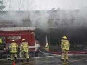 Firefighters from Fire District 6, Vancouver Fire Department and Clark County Fire and Rescue responded to a three-alarm fire at Holly Park Shopping Center in Hazel Dell. Recent training helped firefighters save the building, Fire District 6 officials say.