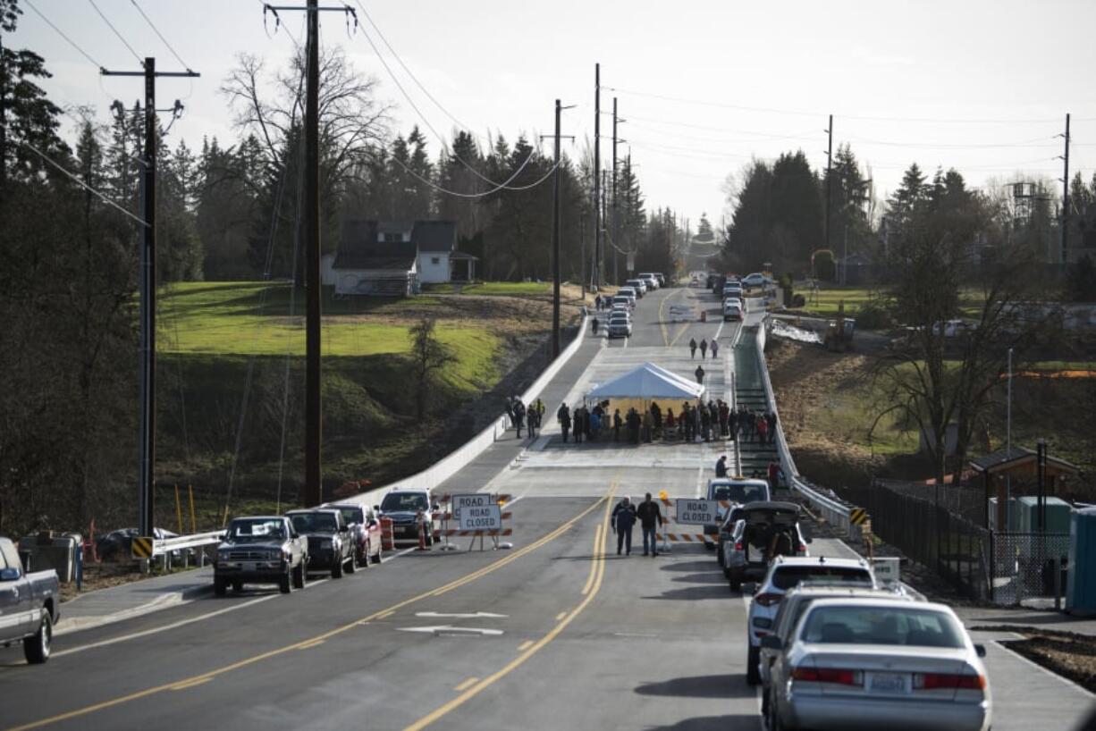 Local officials and community members gathered for the ribbon cutting of the new bridge over Whipple Creek on Dec. 18. It is now open to traffic.