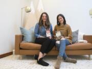 Slumberkins co-founders Callie Christensen, left, and Kelly Oriard sit with two of their plush creations at the Slumberkins offices in downtown Vancouver.