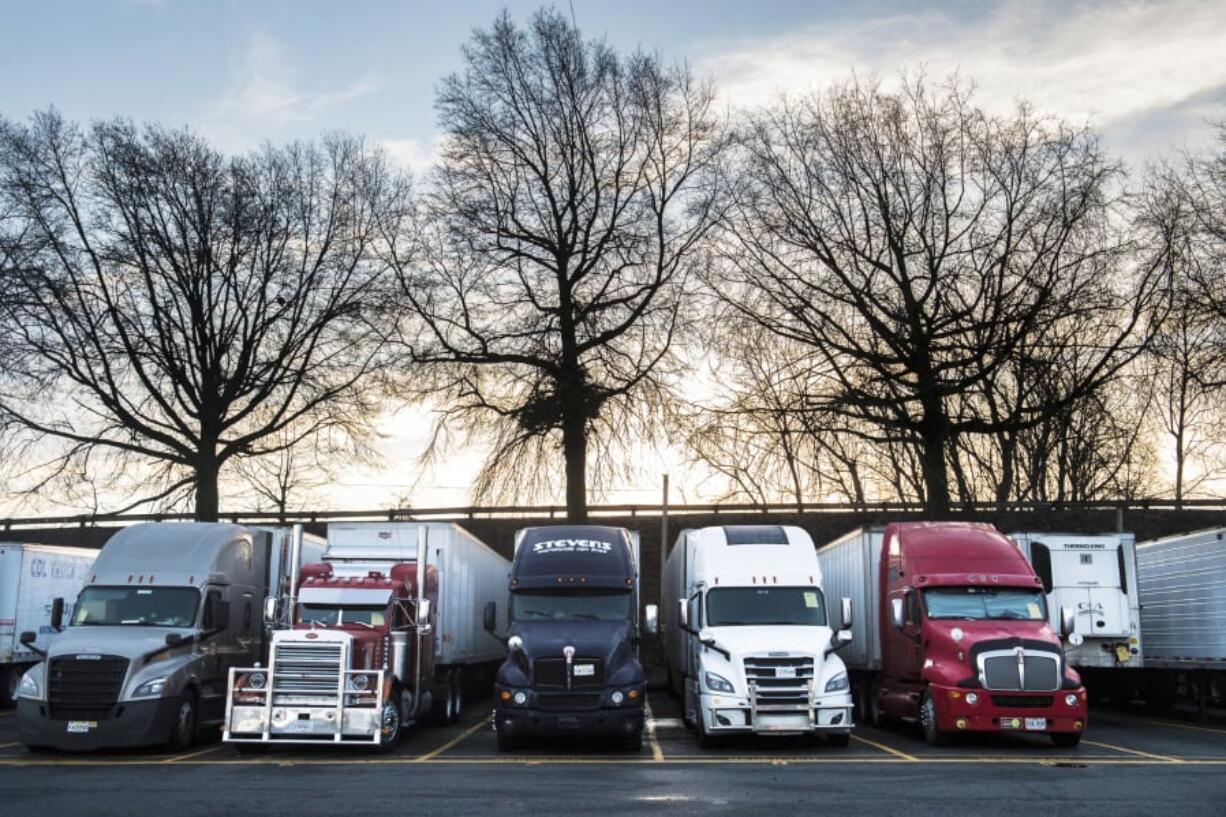 Trucks line up at the Jubitz Truck Stop, a North Portland landmark, just before or after truckers cross the Interstate 5 Bridge.